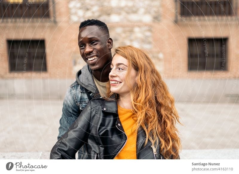 Multiethnic Young Couple front view portrait relationship multi-racial black man caucasian multi-cultural multi-ethnic together boyfriend girlfriend smiling