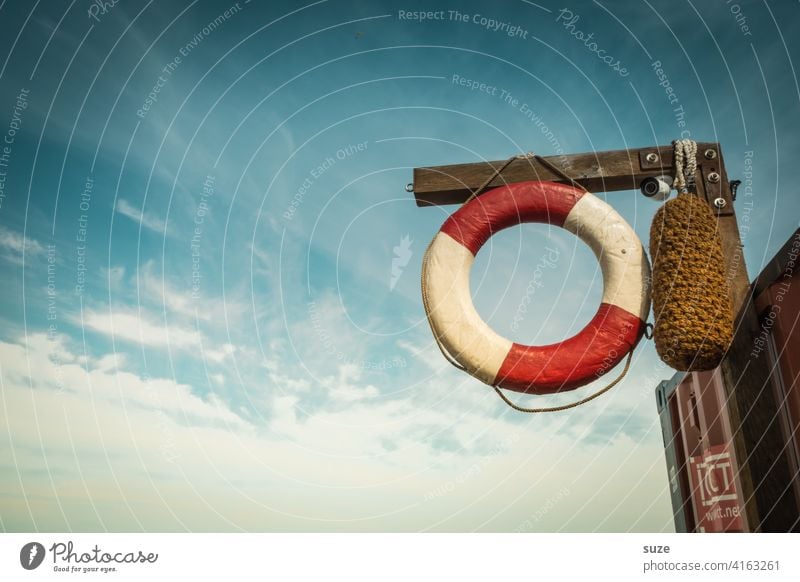 Rescue approaches Maritime Life belt Sky Deserted Colour photo Exterior shot Day Red White Safety Detail Help Round Swimming & Bathing Vacation & Travel Summer