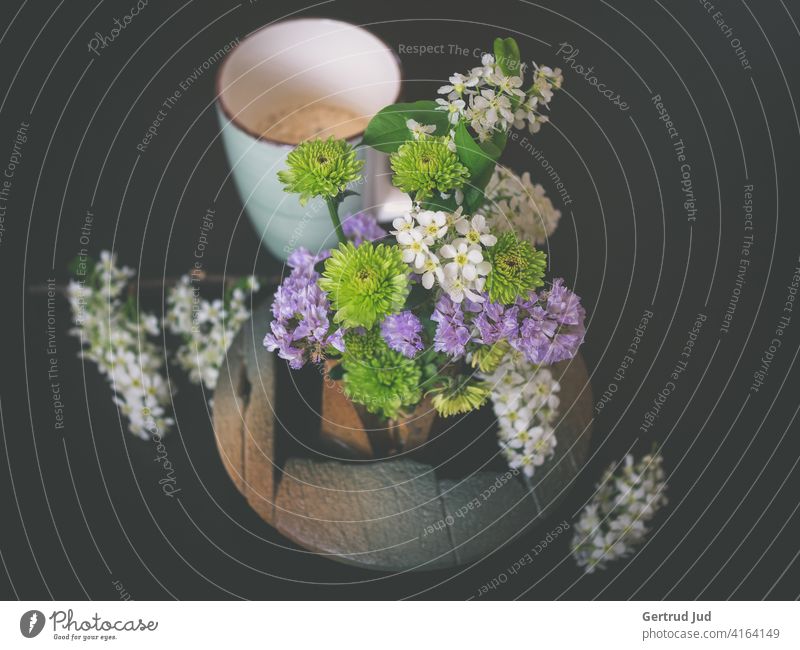 Still life with flowers and coffee cup on dark background Flower Spring Coffee cup Still Life Colour photo Plant Blossom Nature Close-up Green Deserted inboard