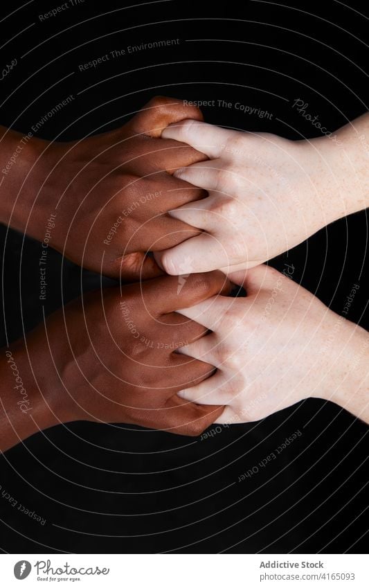 Multiethnic women holding hands in studio racial equal friendship concept close best friend together relationship multiethnic multiracial diverse support show