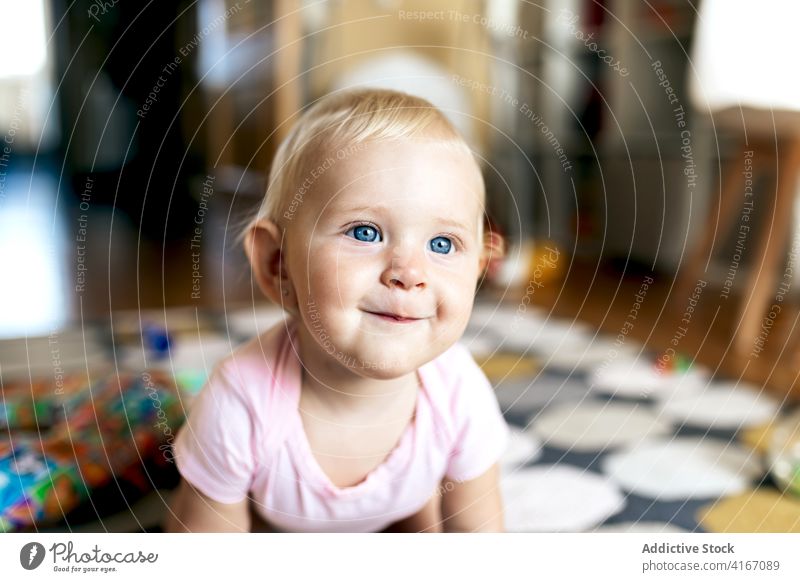 baby girl playing on floor home happy having fun toy grimace love daughter together adorable young child toddler motherhood cute joy bonding relationship enjoy