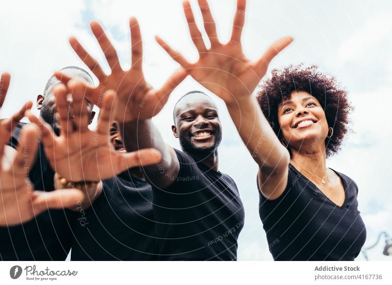 Hand of happy black people against a blue sky closeup female woman isolated white palm person human gesture hand sign young finger concept showing girl