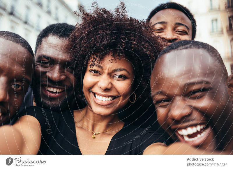 Group of friends taking a selfie black lifestyle happy young people mobile phone female beautiful technology fun outdoors african friendship portrait american