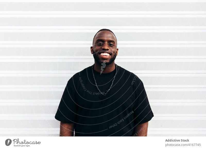 Happy black man posing over white background happy portrait african people american male person guy adult expression one laughing confidence face cool cheerful