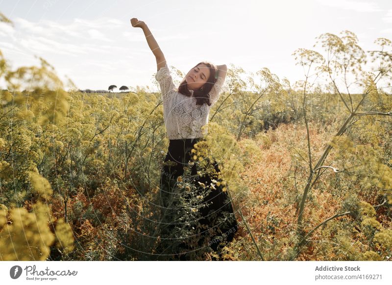 Charming woman in field in summer relax charming countryside chill tender smile meadow female rest calm serene grass idyllic casual peaceful happy nature
