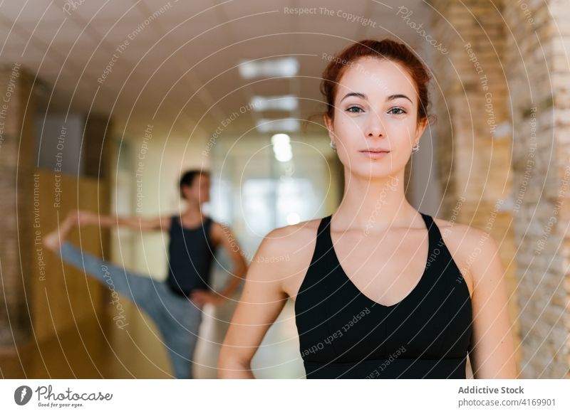 Young woman during yoga lesson studio rest zen mindfulness hobby slim practice female young calm group peaceful class fit harmony wellness serene wellbeing