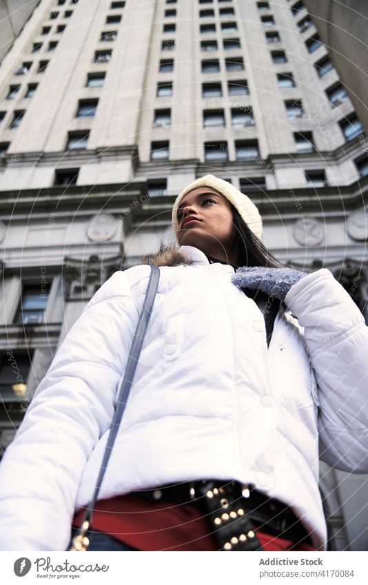 Black woman during stroll in city warm jacket white cold warm clothes outerwear trendy female ethnic black african american usa united states new york street