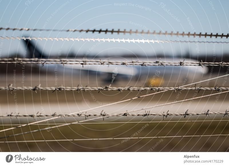 The diversity of the barbed wire society Barbed wire Barbed wire fence Airplane Safety Exterior shot Metal Threat Thorny Fence Barrier Protection Border