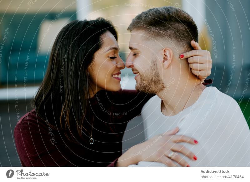 Loving couple face to face with closed eyes touch nose tender love relationship eyes closed enjoy soulmate smile happy relax boyfriend together cheerful