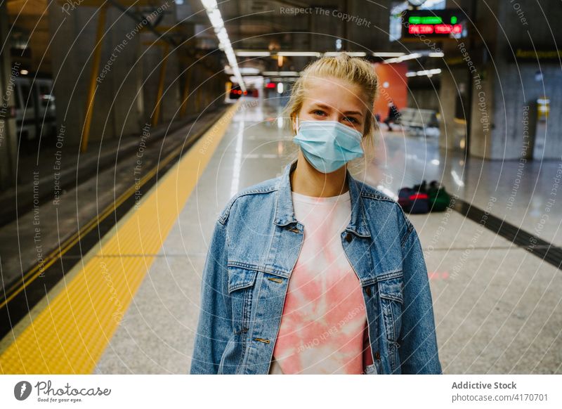 Woman in protective mask on platform of train station woman tourist railroad medical trip wait coronavirus female journey covid19 covid 19 transit railway