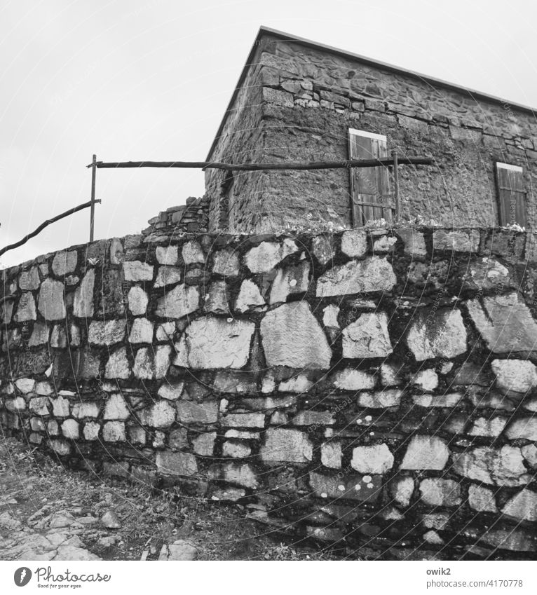 bulwark Wall (barrier) stones bricks piled up Tall Firm rail Protection Simple Building Shed Old forsake sb./sth. abandoned House (Residential Structure) Sky