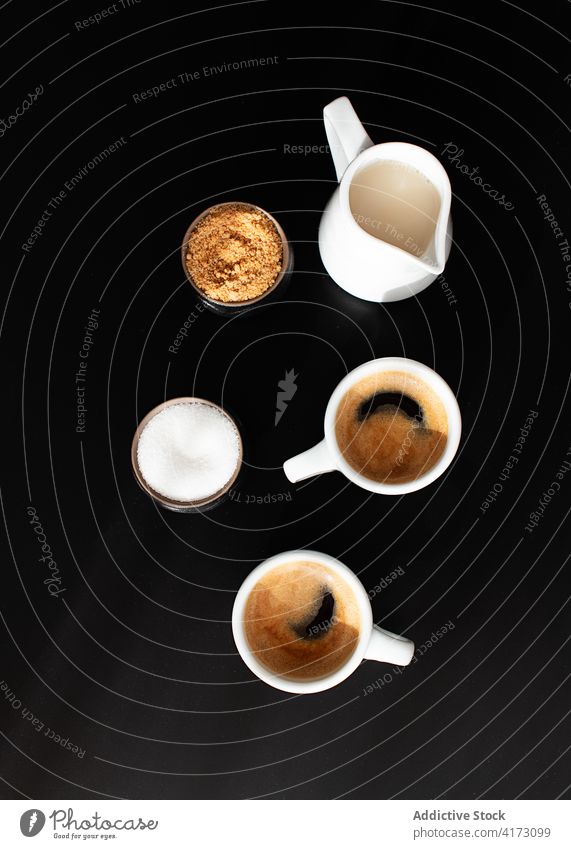 Cups of coffee served on a tray on dark background top aromatic specialty cups brew italian strong black coffee cups of expresso grain concept above mocha