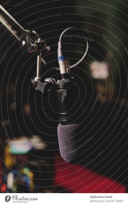 Modern microphone in broadcast studio radio station record on air dark professional equipment device live music contemporary electronic media creative modern