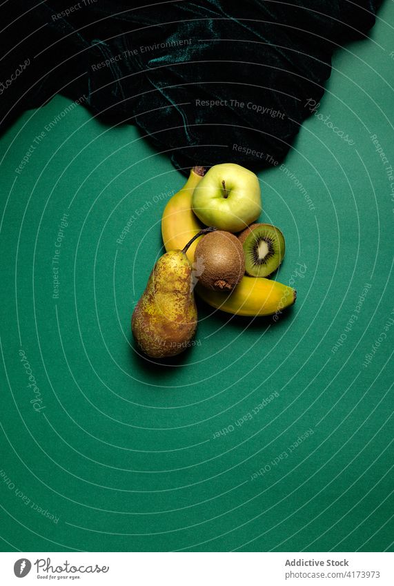 Various green fruits on table various fresh natural pear apple kiwi banana food healthy organic vitamin ripe color nutrition diet vegetarian tasty colorful
