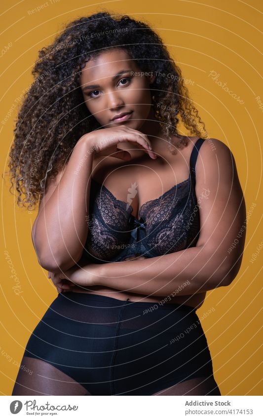 Plus size ethnic woman in lace lingerie fashion plus size overweight bra style delicate model underwear confident young african american black female serious