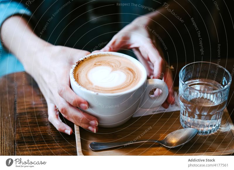 Woman drinking coffee with glass of water cup woman aromatic hot cafe female bartender fresh beverage tasty cafeteria delicious hot drink refreshment relax