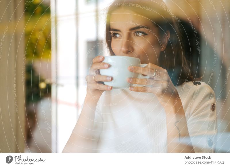 Woman enjoying hot coffee at home woman drink window morning cup calm relax rest tranquil peaceful serene hot drink young female aromatic cozy tea harmony
