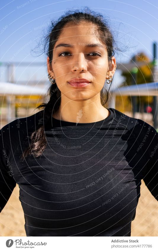 Slim athletic woman on beach sports ground confident sportswoman athlete fit body sportswear activewear determine female ethnic healthy sporty wellness energy