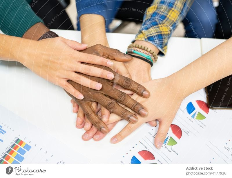 Startup team stacking hands together in office colleague business startup stack hands coworker collaborate cooperate success strategy multiracial multiethnic