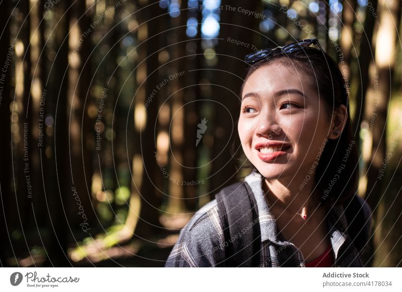 Asian woman with backpack in forest backpacker woods summer adventure woodland cheerful wanderlust female asian ethnic alishan township taiwan nature smile
