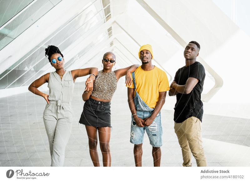 Company of black friends standing together on street cool company style urban unity gather trendy ethnic african american city young contemporary group