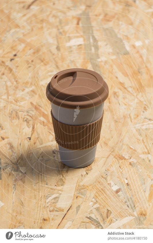 Disposable cup with silicone ring and cap in studio paper cup disposable coffee takeaway drink to go beverage recycle zero waste concept minimal style hot drink