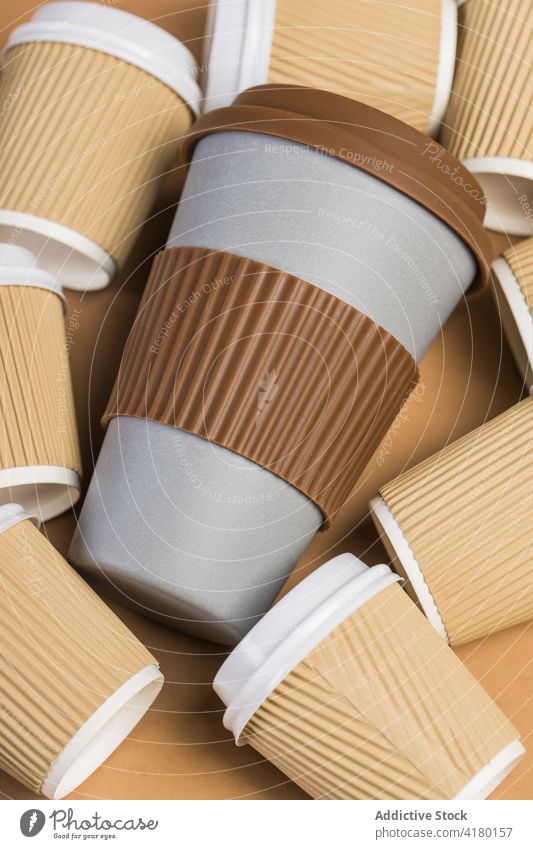 Reusable cups of takeaway coffee served on wooden beverage reuse zero waste eco friendly drink paper cup concept hot drink to go cafe table disposable refuse