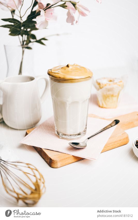 Delicious latte with fluffy whipped cream beverage coffee drink foam spoon milk caffeine froth sweet treat fresh kitchen energy delicious ingredient hot serve