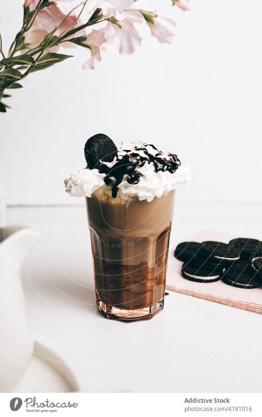 delicious frappe with chocolate cookies person coffee garnish sweet indulge biscuit beverage cocoa drink fresh kitchen dessert energy decorate blend add warm