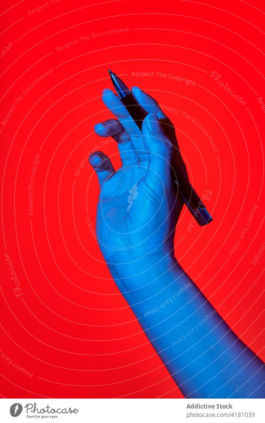 Woman's hand writing with a pen human woman wrist handwriting write red background person finger communicate message vertical ideas inspiration lady draw note