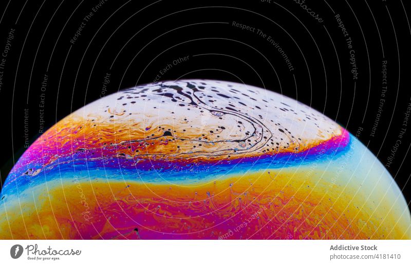 Abstract background of bright soap bubble representing planet universe cosmos galaxy earth astronomy world colorful astrology texture shape abstract wavy line