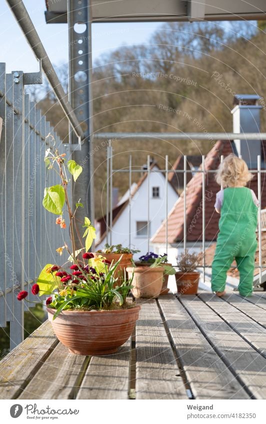 Balcony with kid in lockdown Spring Toddler Child home office Break plants gardening Flowerpot Sunday free time Family