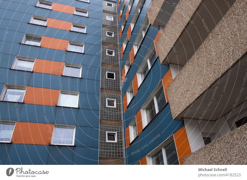 Living in a skyscraper Apartment Building Blue Orange House (Residential Structure) Facade Window Town Deserted Living or residing Residential area Gloomy