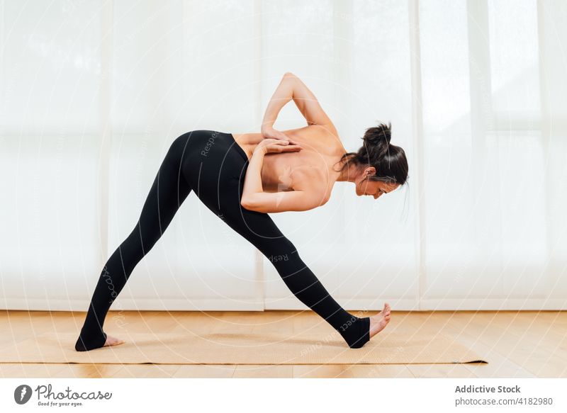 Smiling women training yoga positions in modern - Stock Photo  [100665919] - PIXTA