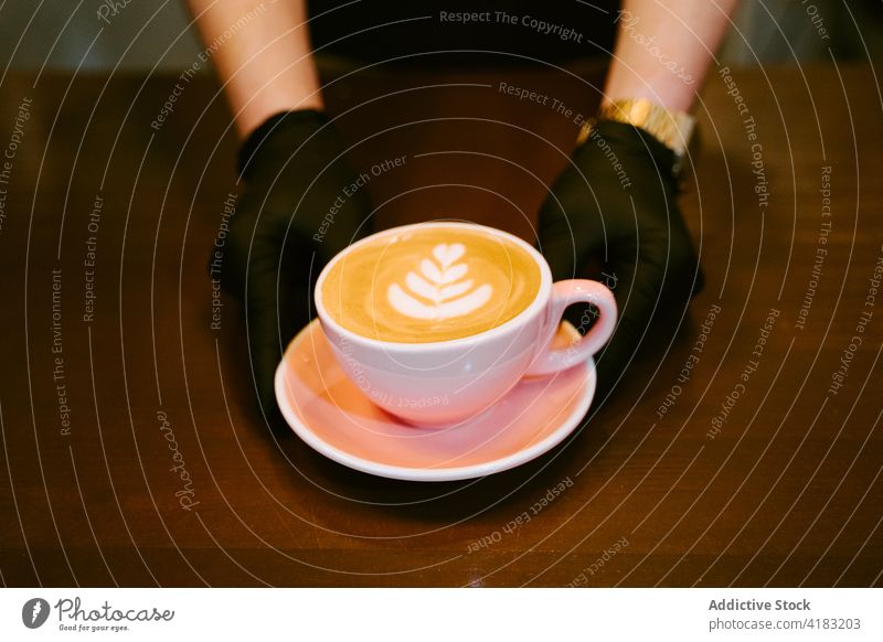 Closeup of a cup of coffee with milk seen from above isolated capuccino breakfast drink cafe white cappuccino hot latte beverage brown background aroma art