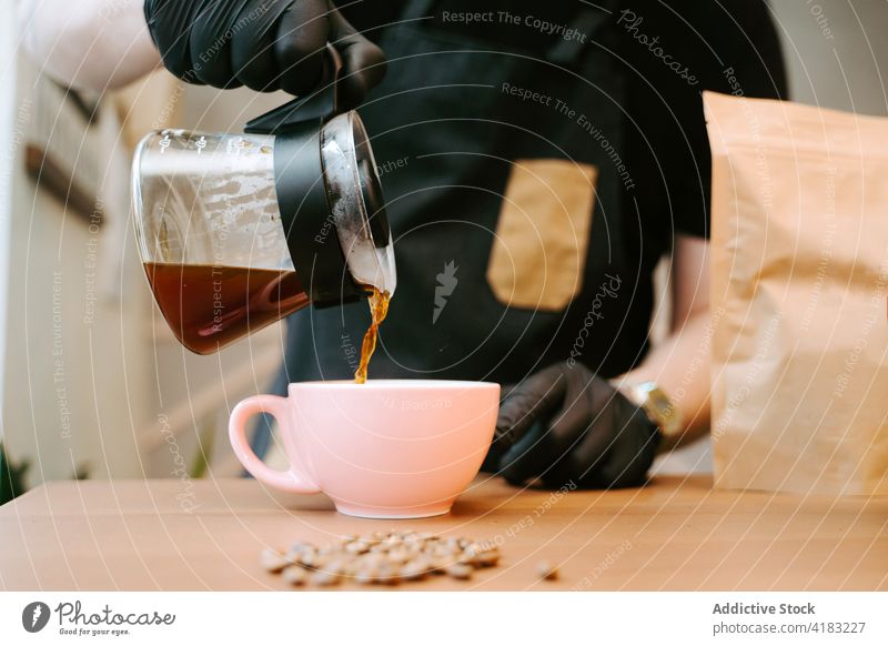 Closeup of a cup of coffee seen from above isolated breakfast drink cafe hot beverage brown background aroma art morning sweet caffeine cream top tasty closeup
