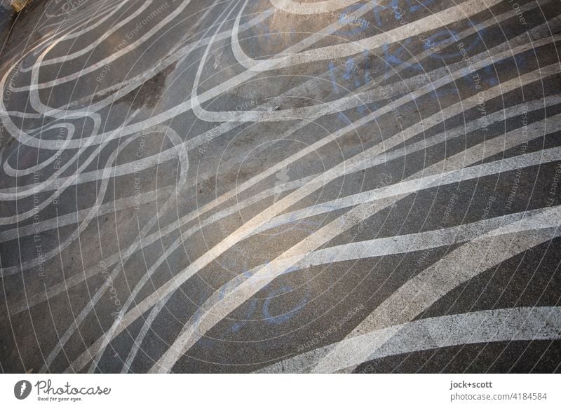 criss-crossing lines on asphalt Line Many Double exposure Reaction Illusion Abstract Structures and shapes Irritation Uneven Ground markings Skate park Complex
