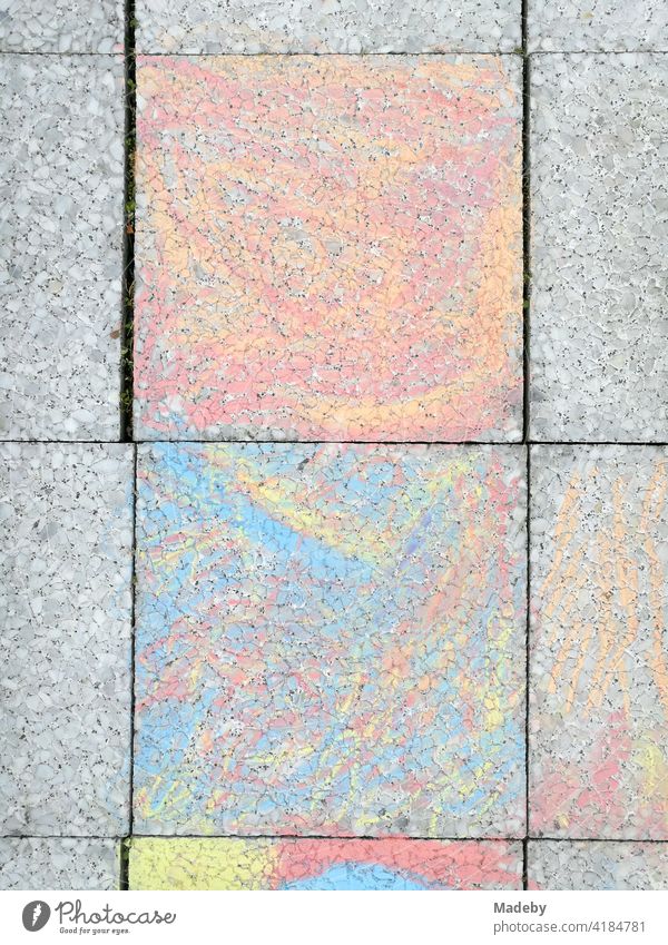 Chalk drawing in pastel colours on the grey stone slabs of a balcony in Oerlinghausen near Bielefeld in the Teutoburg Forest in East Westphalia-Lippe Drawing