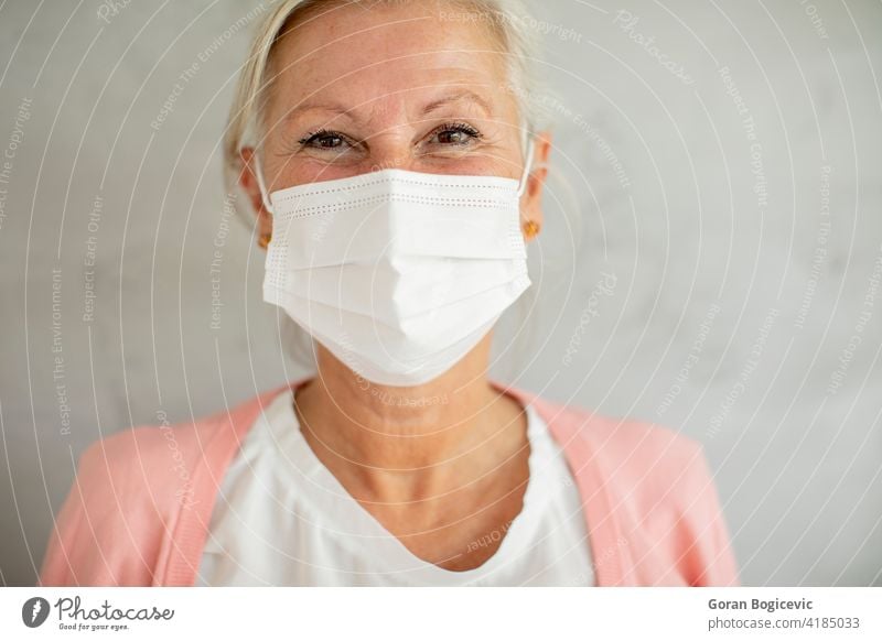 Portrait of senior woman wearing protective medical mask for protection from virus coronavirus elderly old epidemic person portrait mature pandemic prevention