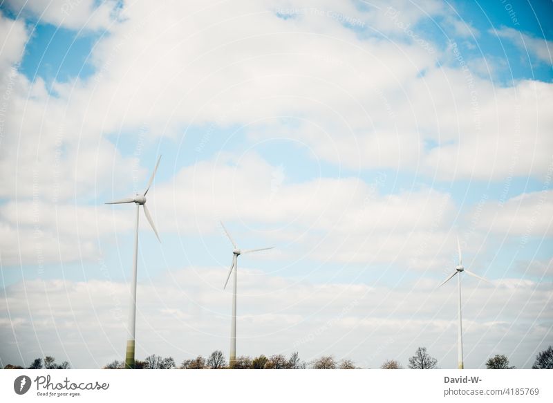 Three wind turbines in nature windmills Wind turbines wind power Renewable energy Power Generation Eco-friendly Energy Energy industry Ecological