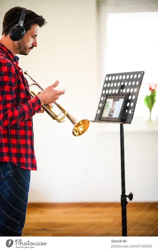 Musicians teaching Lessons Online Tablet computer music teacher transfer Student Ipad home office labour Man Trumpet Musical instrument music student Digital