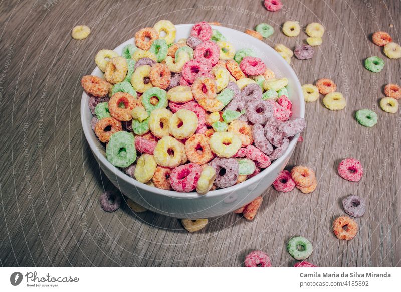 Colorful cereal  in a bowl for breakfast. background box carbs colorful delicious dessert floor food fresh fruit green home kids loops milk morning nutrition