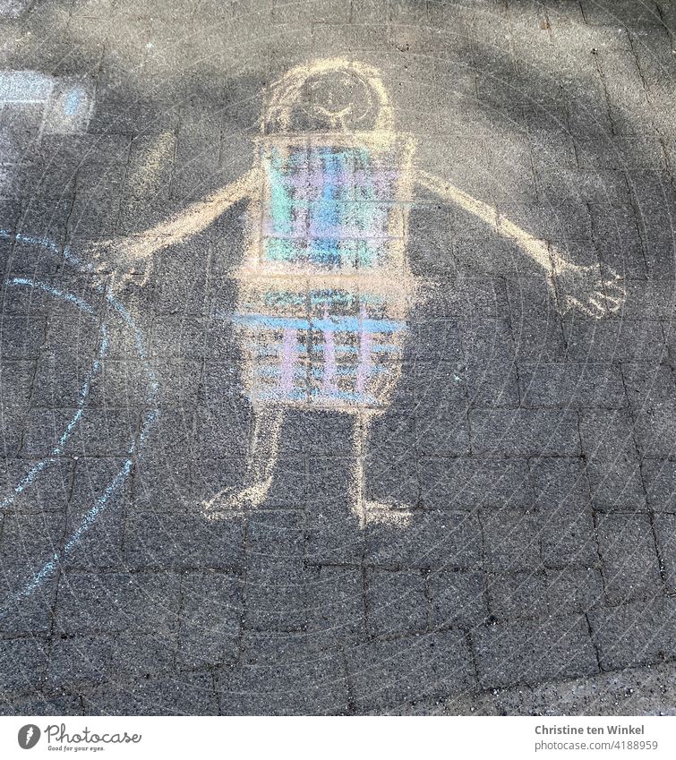 Children's drawing with colorful street crayon on a sidewalk. Figure with plaid clothes. street-painting chalk Drawing off Street variegated