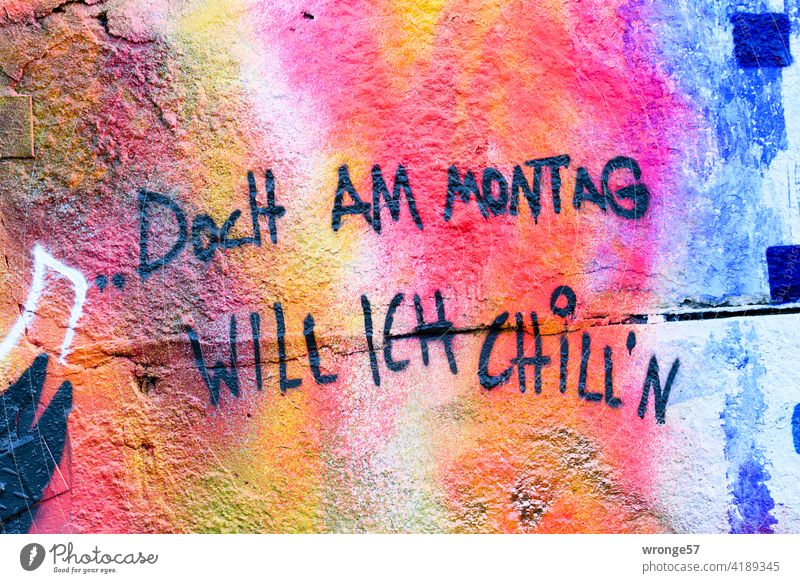 But on Monday I want to chill'n - sprayed with black paint on a colorful wall Graffiti variegated Wall (barrier) Landscape format