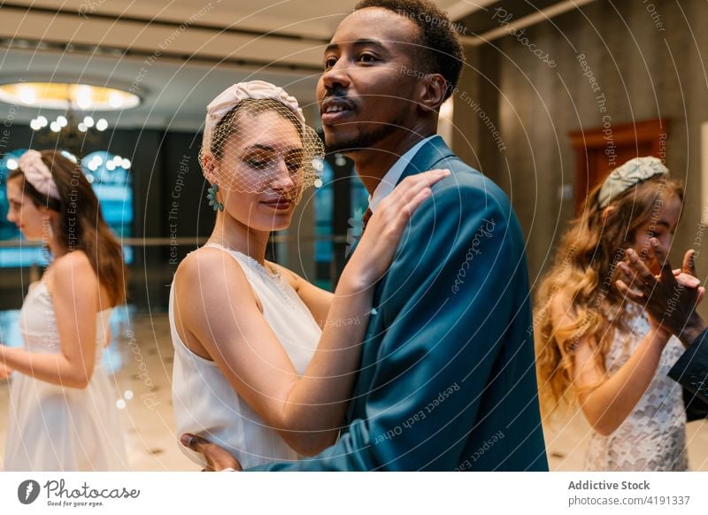 Happy couple dancing in hall on wedding day newlywed dance together elegant bride groom celebrate occasion black african american multiracial multiethnic