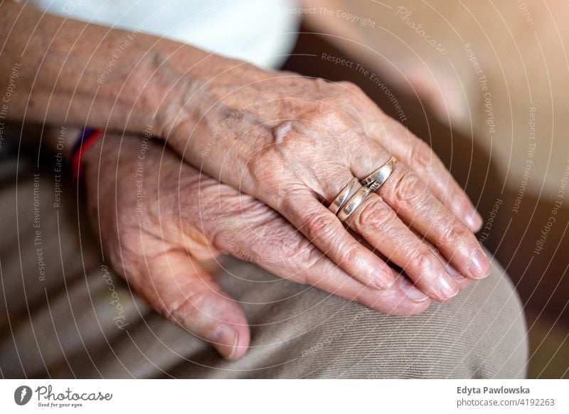 Close up of senior couple holding hands patient caucasian health support closeup aging aged wrinkled finger skin human care grandparents pensioners grandfather