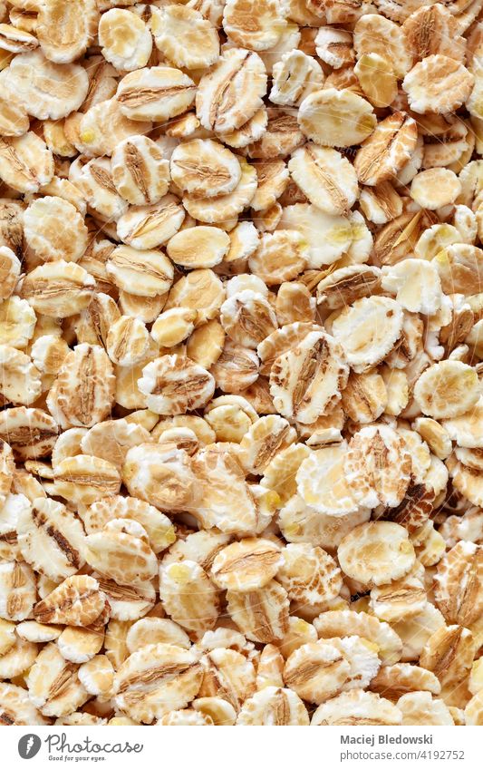 Close up picture of barley flakes. food dry natural raw breakfast fiber healthy cereal ingredient diet organic heap whole vegan dietary fiber close up