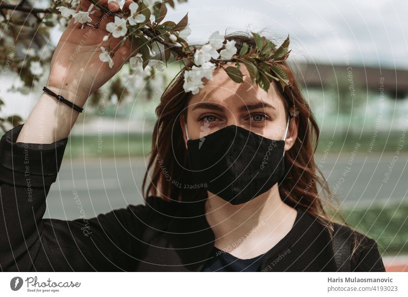 beautiful woman with face mask, spring time, covid 19 spring attractive background beauty black blossom blossom tree coronavirus emotions facial mask girl green