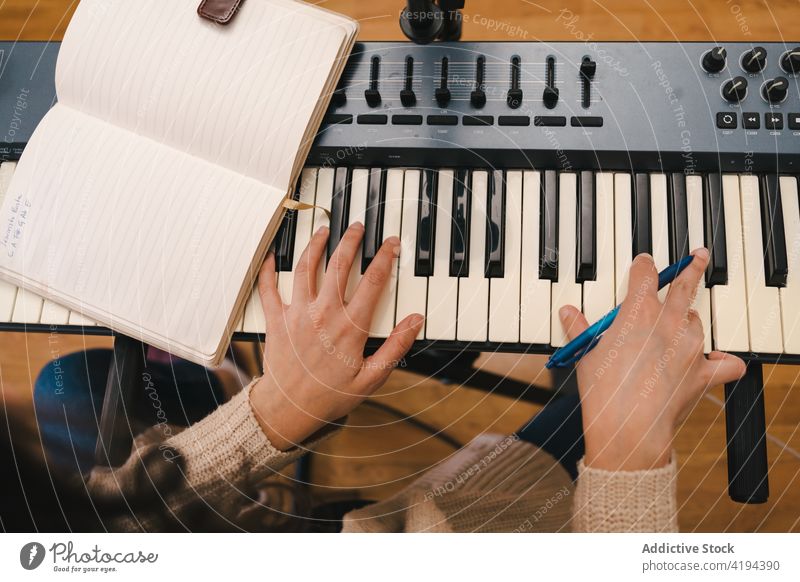 Woman playing synthesizer and creating song compose woman music piano create musician home female sound melody instrument talent tune inspiration art