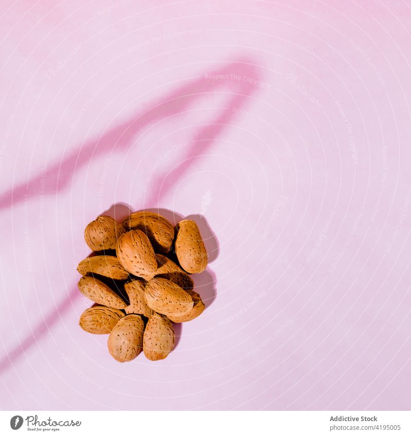 Rows of crunchy almonds on light background nut unique unusual concept snack protein natural vitamin organic product crispy oval shape cut row tasty surface dry